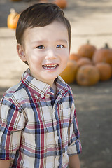 Image showing Mixed Race Young Boy Having Fun at the Pumpkin Patch