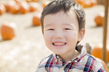 Image showing Mixed Race Young Boy Having Fun at the Pumpkin Patch