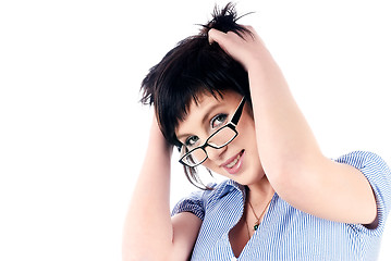 Image showing Attractive smiling girl with hands in hair