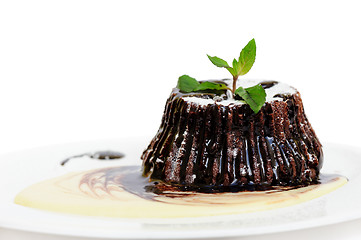 Image showing Chocolate fondant with peppermint leaves