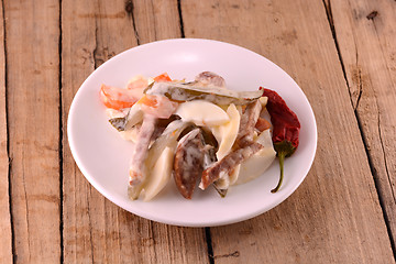 Image showing Healthy salad with fresh vegetables on wooden background