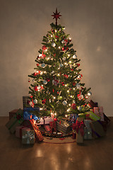 Image showing illuminated christmas tree with presents