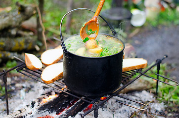 Image showing The cooking of soup on the fire