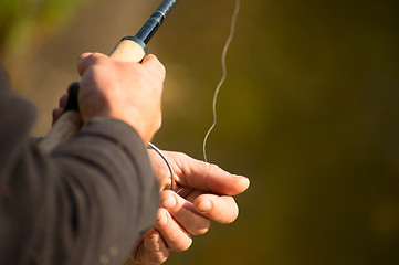 Image showing Spinning in the hands of the angler 