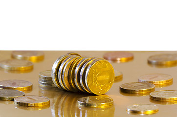 Image showing Coins are reflecting in the Golden surface