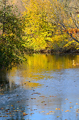 Image showing Autumn landscape with reflection in the water of trees with brig