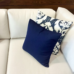 Image showing White sofa with blue cushions