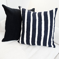 Image showing Striped cushion on a sofa