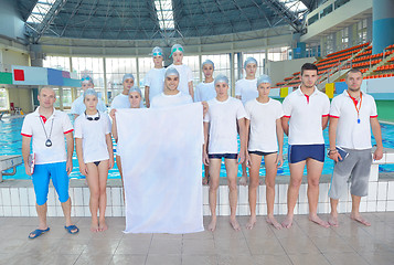 Image showing children group  at swimming pool with empty white flag