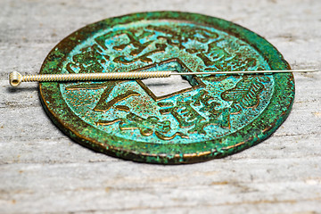 Image showing acupuncture needle on chinese coin