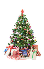 Image showing Christmas tree with ornaments and gifts isolated