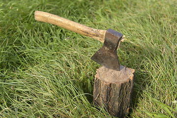 Image showing Firewood and old axe