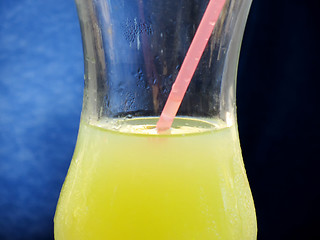 Image showing Glass of juice with straw