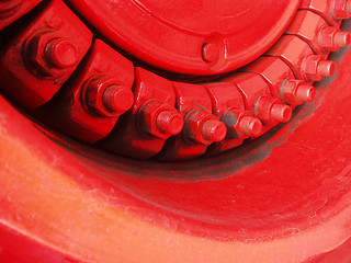 Image showing Red metal screws