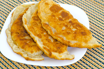 Image showing Chebureks on the table on a white plate