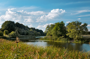 Image showing Autumn landscape with river and clouds