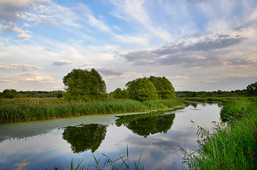 Image showing Landscape with river bend and clouds reflected in the water