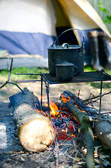 Image showing Tourist boiler mug and heated over a fire of wood