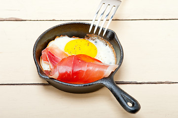 Image showing egg sunny side up with italian speck ham