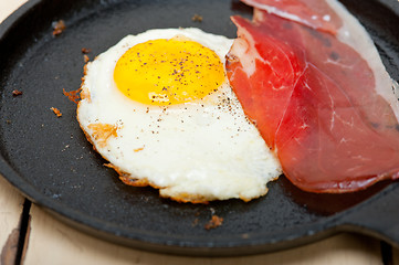 Image showing egg sunny side up with italian speck ham