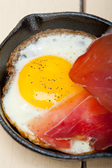 Image showing egg sunny side up with italian speck ham