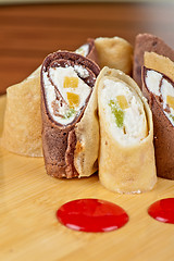 Image showing pancake roll with marmalade