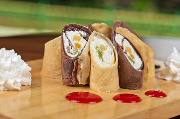 Image showing pancake roll with marmalade