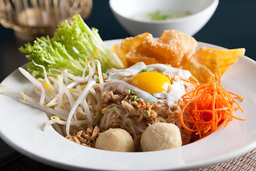 Image showing Thai Noodle Dish with Fried Egg