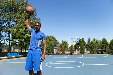 Image showing Basketball Player Palming the Ball