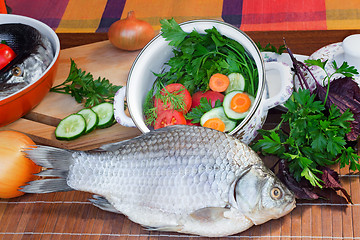 Image showing Fish and components for her preparation: vegetables, spices, par