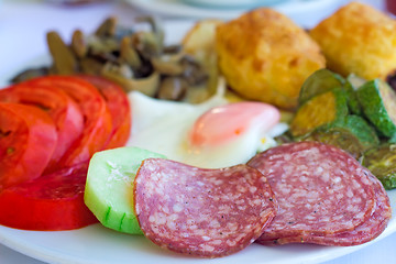 Image showing Sausage and scrambled eggs with owoseni on the plate.