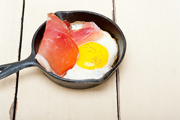 Image showing egg sunny side up with italian speck ham