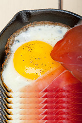 Image showing egg sunny side up with italian speck ham