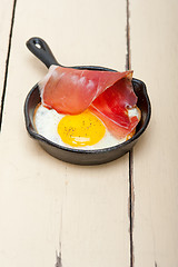 Image showing egg sunny side up with italian speck ham