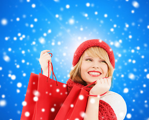 Image showing smiling young woman with shopping bags