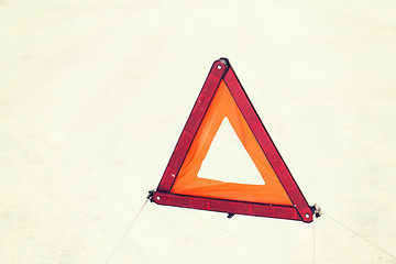 Image showing closeup of warning triangle on snow