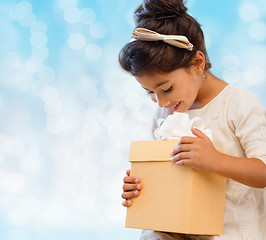 Image showing smiling little girl with gift box