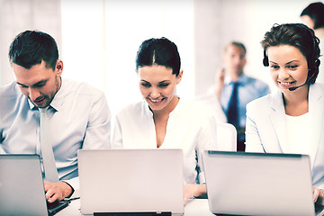 Image showing group of people working with laptops in office