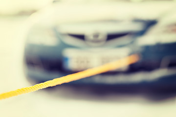 Image showing closeup of towed car with towing rope