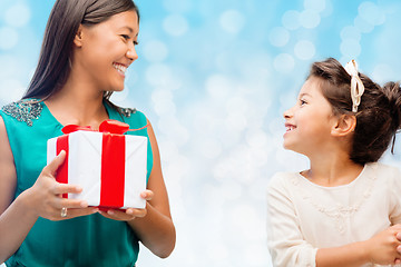 Image showing happy mother and little girl with gift box