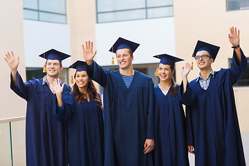 Image showing group of smiling students in mortarboards