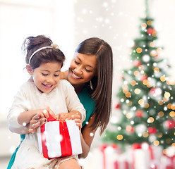 Image showing happy mother and child girl with gift box