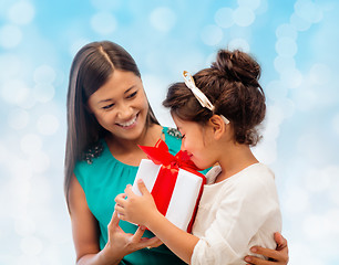 Image showing happy mother and little girl with gift box