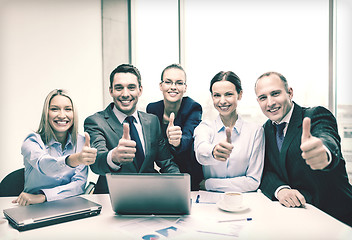 Image showing business team showing thumbs up in office