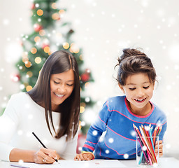 Image showing mother and daughter with coloring pencils indoors