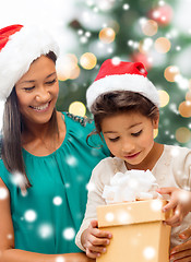 Image showing happy mother and child girl with gift box