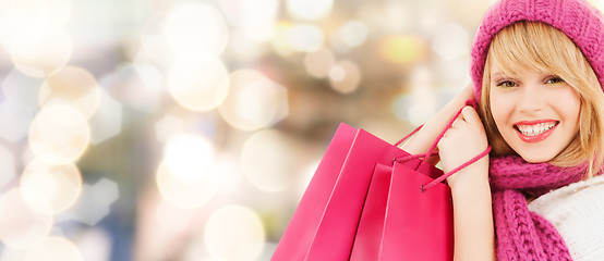 Image showing smiling young woman with shopping bags