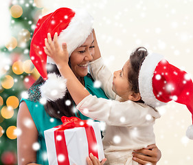 Image showing happy mother and child girl with gift box