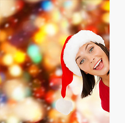 Image showing woman in santa helper hat with blank white board