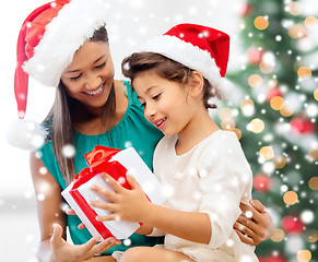 Image showing happy mother and child girl with gift box